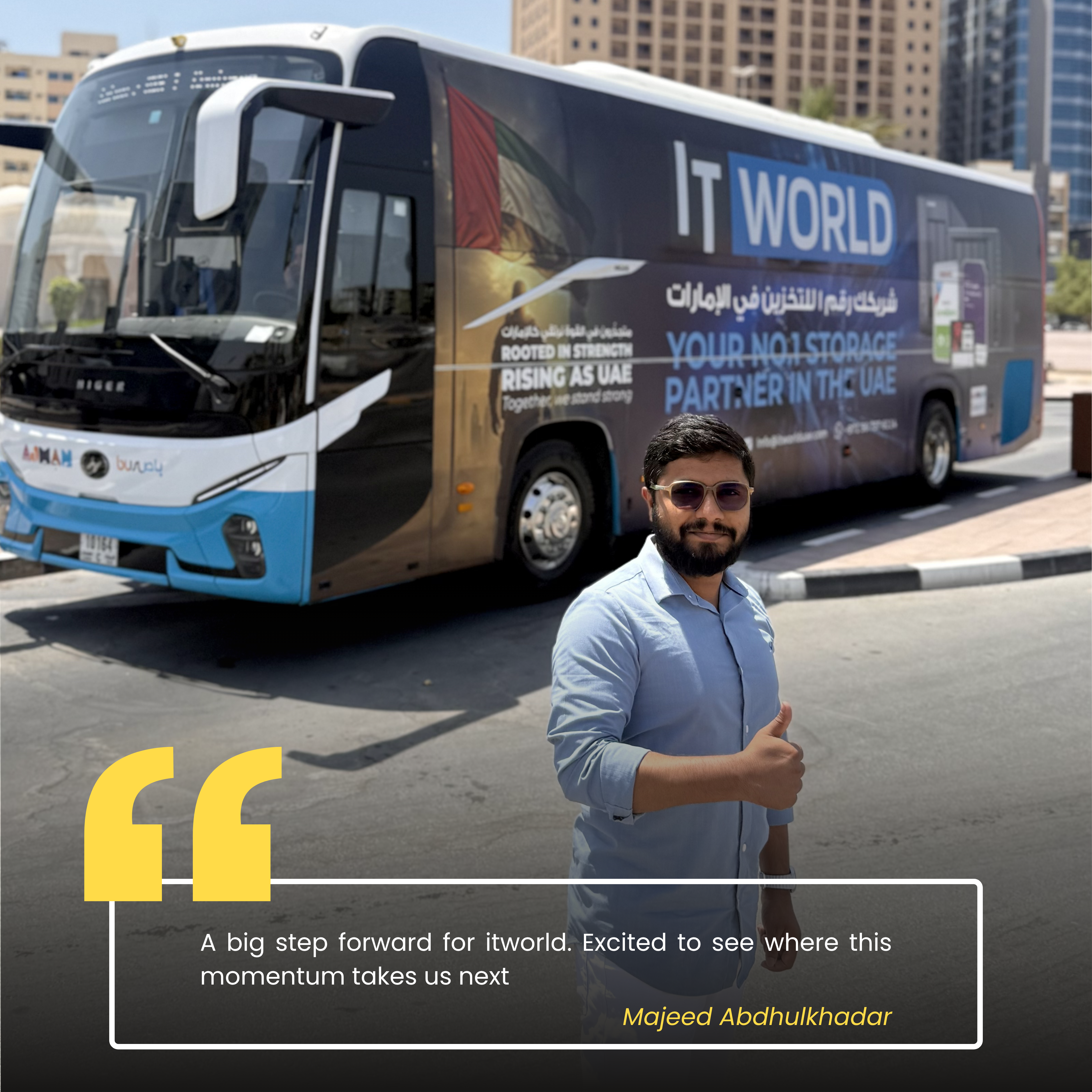Majeed — IT World Trading team member, photographed beside the RTA campaign bus